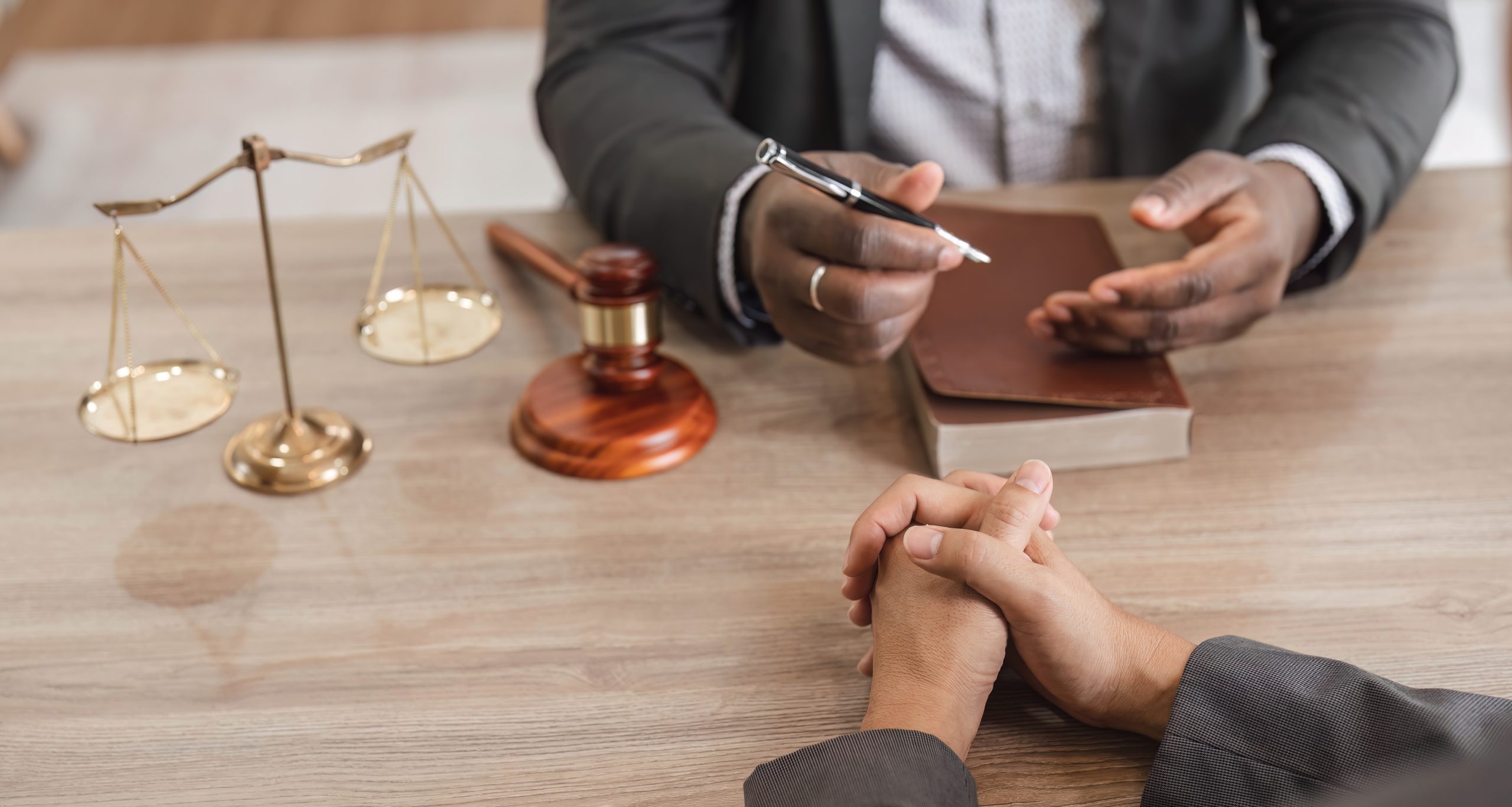 Business team and lawyers discussing contract papers sitting at the table. Concepts of law, advice, legal services. at office