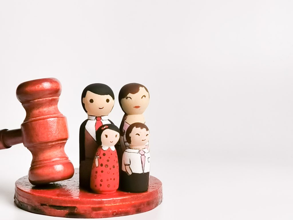 family-law-concept-wooden-dolls-family-with-gavel-2023-11-27-05-20-03-utc