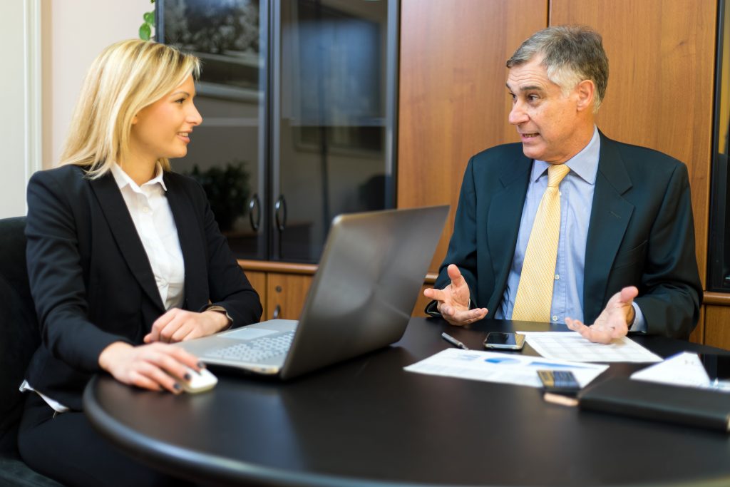 Two business partners discussing plans or ideas at meeting