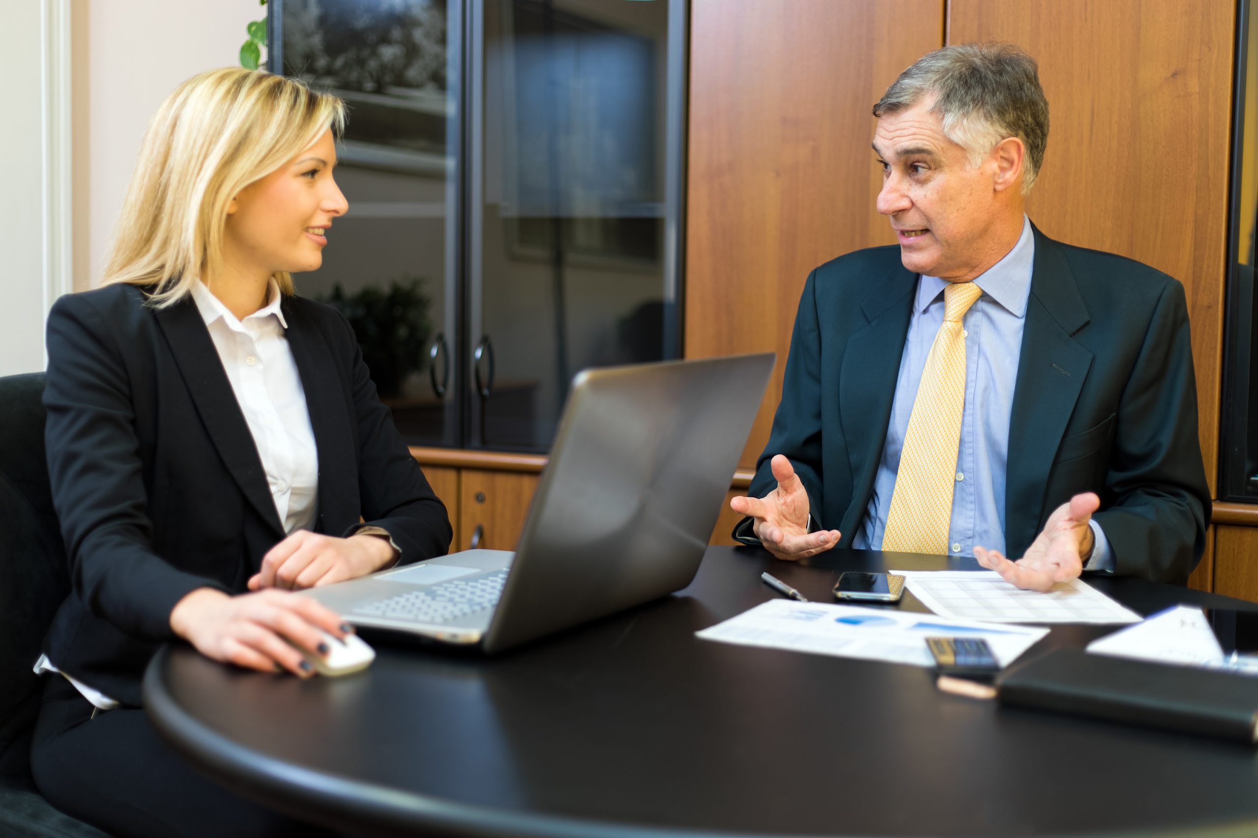 Two business partners discussing plans or ideas at meeting