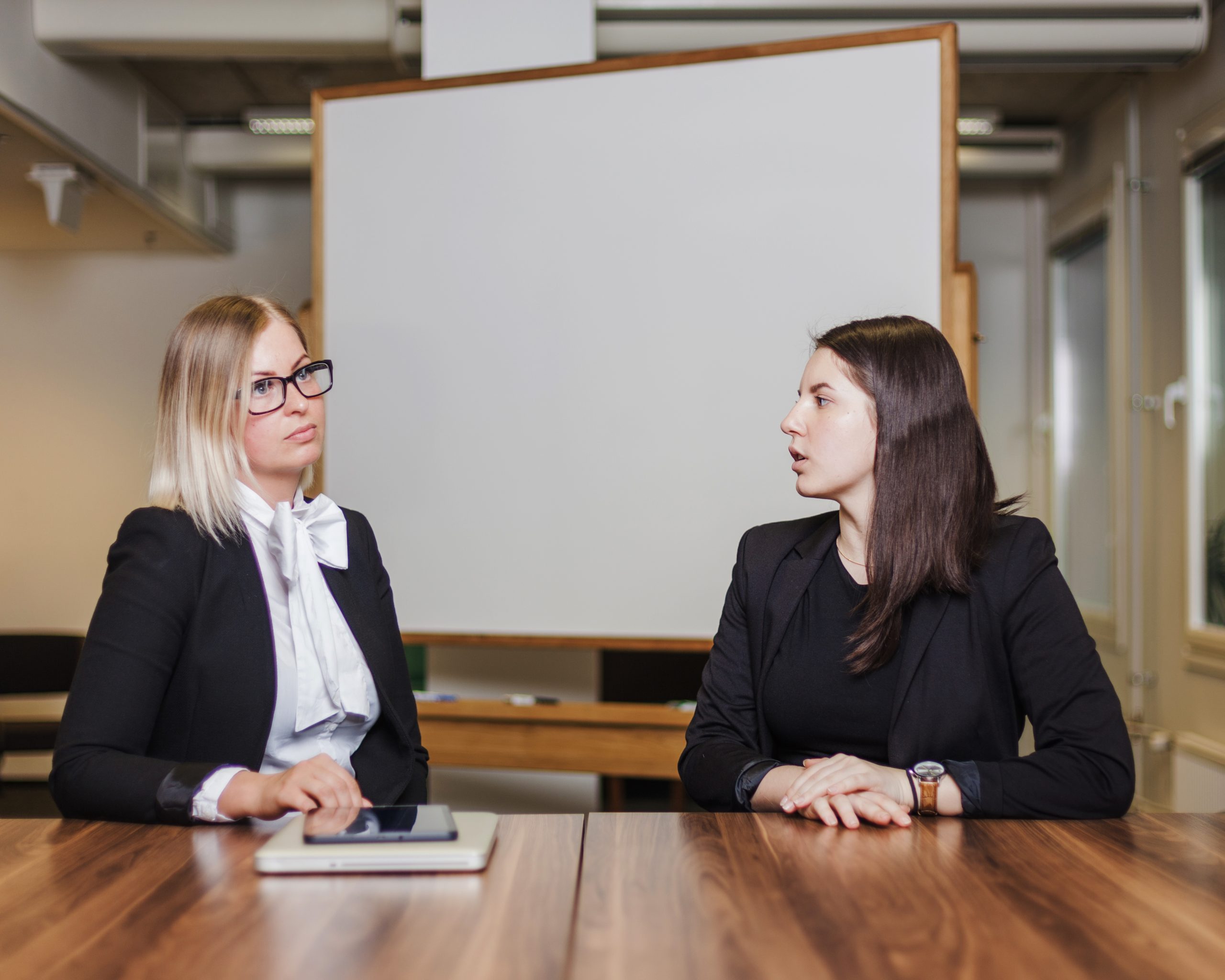 women-sitting-table-talking